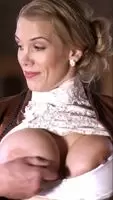 Getting help to get her big tits to fit in her bra