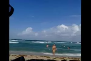 Sexy brunette goes naked from the sea