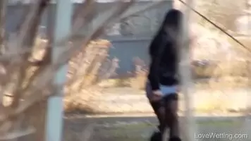 Lucia Denville pissing from behind