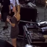 DJ dancing behind the decks