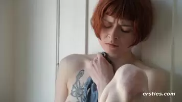 Enne rubs herself.