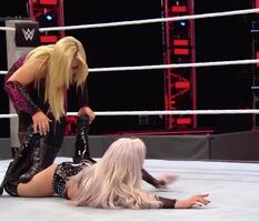 Natalya slaps Liv's ass