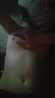 Sorry it's dark, but here's my boyriend playing with my small tits