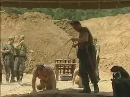Unlucky prisoner gets punished by the sergeant.