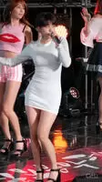 TAHITI Ari in a tight dress twirling