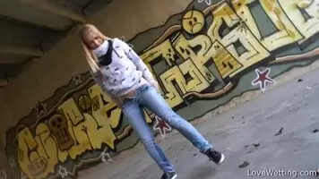 Violeta Wets Her Jeans Under A Bridge