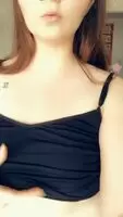 elt like showing what’s hiding under this tight black tank top 💋