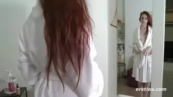 Claudia disrobing.