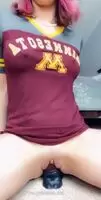 she is riding it by the way which college shirt is that