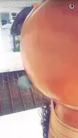 Kim Kardashian Showing Off Her Oiled Ass